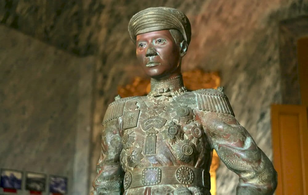 The statue captures the emperor in regal attire, embodying his authority